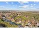 Aerial view of the property showcasing the home's location surrounded by lush trees at 214 Harbor Landing Dr, Mooresville, NC 28117