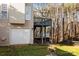 Backyard view featuring a raised deck and a partially-viewable lower deck overlooking a mature tree line at 214 Harbor Landing Dr, Mooresville, NC 28117