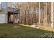 Spacious backyard with a raised deck and a partially-viewable lower deck, fire pit, and privacy fence at 214 Harbor Landing Dr, Mooresville, NC 28117
