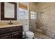 Bathroom featuring tiled shower with glass door, and wood vanity at 214 Harbor Landing Dr, Mooresville, NC 28117
