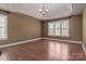 Open bedroom space offering hardwood floors and a well-lit room at 214 Harbor Landing Dr, Mooresville, NC 28117
