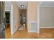 Entry hall features warm paint colors, wood flooring, and white trim at 214 Harbor Landing Dr, Mooresville, NC 28117