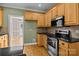 Charming kitchen offers stainless steel appliances, stylish backsplash, and light colored cabinets at 214 Harbor Landing Dr, Mooresville, NC 28117