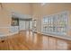 Open-concept living room with hardwood floors and large windows providing ample natural light at 214 Harbor Landing Dr, Mooresville, NC 28117