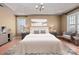Comfortable main bedroom provides a tray ceiling, neutral walls, and great natural light at 214 Harbor Landing Dr, Mooresville, NC 28117