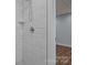 Modern tiled shower with sleek fixtures and ample space, offering a luxurious bathing experience at 214 Harbor Landing Dr, Mooresville, NC 28117