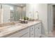 Bathroom with double sinks, granite countertops, decorative mirrors, and tile flooring at 2150 Millennium Dr # 094, Lancaster, SC 29720