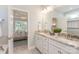 Bright bathroom with double vanity, granite countertop, large mirror, and a view into the bedroom at 2150 Millennium Dr # 094, Lancaster, SC 29720