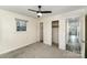 Bright carpeted bedroom with natural light, closet, and neutral walls at 303 S Eastway Dr, Troutman, NC 28166