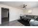 Cozy living room with a ceiling fan and grey sofa at 303 S Eastway Dr, Troutman, NC 28166