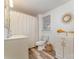 Updated bathroom with white vanity, modern fixtures, and a shower/tub combination at 308 W Charlotte Ave, Mount Holly, NC 28120