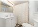 Updated bathroom with white vanity, modern fixtures, and a shower/tub combination at 308 W Charlotte Ave, Mount Holly, NC 28120