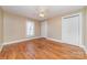 Cozy bedroom featuring refinished hardwood floors and natural light at 308 W Charlotte Ave, Mount Holly, NC 28120