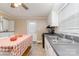 Cozy kitchen features a stainless sink, neutral cabinetry, and gas range at 308 W Charlotte Ave, Mount Holly, NC 28120