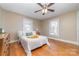 Bright bedroom with hardwood floors, large windows and a ceiling fan at 308 W Charlotte Ave, Mount Holly, NC 28120