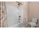 A bright bathroom with a shower-tub combo, white tile surround, a white shower curtain, and a tile floor at 3090 Tallgrass Blf, Rock Hill, SC 29732