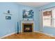 Bright living area with a fireplace as a focal point, complemented by natural light and blue wall paint at 3090 Tallgrass Blf, Rock Hill, SC 29732