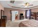 Comfortable main bedroom with a large bed, a ceiling fan, and view to the dining room at 3090 Tallgrass Blf, Rock Hill, SC 29732