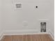 Empty laundry hookups in an otherwise white room with modern baseboards and flooring at 3314 Cedarhurst Dr, Charlotte, NC 28269