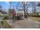 Spacious backyard featuring an outdoor dining area and well maintained lawn at 3501 Winterfield Pl, Charlotte, NC 28205