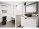 Modern bathroom with a black toilet, white vanity, glass enclosed shower, and granite countertops at 3501 Winterfield Pl, Charlotte, NC 28205