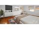 Bright bedroom with hardwood floors, light walls, and a sitting area at 3501 Winterfield Pl, Charlotte, NC 28205