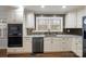 Well-equipped kitchen with stainless steel appliances, granite countertops, and modern backsplash at 3501 Winterfield Pl, Charlotte, NC 28205