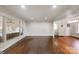 Bright living room features hardwood floors and large windows that provide plenty of natural light at 3501 Winterfield Pl, Charlotte, NC 28205