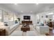 Comfortable living room with hardwood floors, neutral decor, and ample seating arrangements at 3501 Winterfield Pl, Charlotte, NC 28205