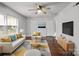 Stylish living room with hardwood floors, a modern sofa, and plenty of natural light at 3501 Winterfield Pl, Charlotte, NC 28205