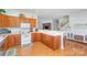 Well-lit kitchen with ample counter space, wooden cabinets, and modern appliances at 3863 Stough Sw Rd, Concord, NC 28027