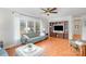 Inviting living room showcasing hardwood floors, a ceiling fan, and a built-in entertainment center at 3863 Stough Sw Rd, Concord, NC 28027