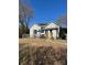 View of backyard with a wooden deck and a patio table with umbrella at 400 Martin Luther King Jr Ave, Kannapolis, NC 28083