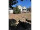 View of backyard with a fire pit and a wooden deck at 400 Martin Luther King Jr Ave, Kannapolis, NC 28083