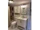 Bathroom with wainscoting, white vanity and tile flooring at 400 Martin Luther King Jr Ave, Kannapolis, NC 28083
