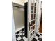 Modern closet with black-and-white checkered flooring, custom shelving, and a glass paned door at 400 Martin Luther King Jr Ave, Kannapolis, NC 28083