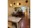 Cozy dining room with wood floors, star decorations, and open archway to the other room, bathed in natural light at 400 Martin Luther King Jr Ave, Kannapolis, NC 28083