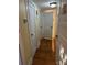 Hallway with hardwood floors, neutral paint, and access to various rooms at 400 Martin Luther King Jr Ave, Kannapolis, NC 28083