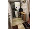 Mudroom with washer/dryer, storage shelves and decorative mats near the entryway at 400 Martin Luther King Jr Ave, Kannapolis, NC 28083
