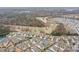 Aerial view of a residential community adjacent to a lush golf course at 5006 Sand Trap Ct # 142, Monroe, NC 28112