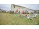 Large backyard features a patio area, a fire pit, and beautiful landscaping at 5006 Sand Trap Ct # 142, Monroe, NC 28112