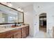 Bright bathroom features granite counter tops, dual sinks and a door to the walk-in closet at 5006 Sand Trap Ct # 142, Monroe, NC 28112