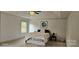A bright bedroom with a tray ceiling, fan, neutral decor, and cozy rug at 5006 Sand Trap Ct # 142, Monroe, NC 28112