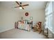 Cozy bedroom features a ceiling fan, plush carpeting, and a cheerful Winnie the Pooh theme at 5006 Sand Trap Ct # 142, Monroe, NC 28112