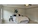 A bright bedroom with a tray ceiling, fan, neutral decor, and cozy rug at 5006 Sand Trap Ct # 142, Monroe, NC 28112