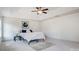 A bright bedroom with a tray ceiling, fan, neutral decor, and cozy rug at 5006 Sand Trap Ct # 142, Monroe, NC 28112