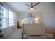 Bright bedroom featuring carpet, a ceiling fan, natural light, and uniquely styled bed at 5006 Sand Trap Ct # 142, Monroe, NC 28112