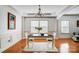 Elegant dining room featuring hardwood floors, natural light, and a decorative chandelier at 5006 Sand Trap Ct # 142, Monroe, NC 28112