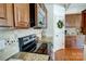 This kitchen includes stone countertops, stainless appliances, a tile backsplash, and lots of cabinet space at 5006 Sand Trap Ct # 142, Monroe, NC 28112