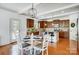 Charming eat-in kitchen featuring wood cabinetry, granite countertops, and a view of the backyard at 5006 Sand Trap Ct # 142, Monroe, NC 28112